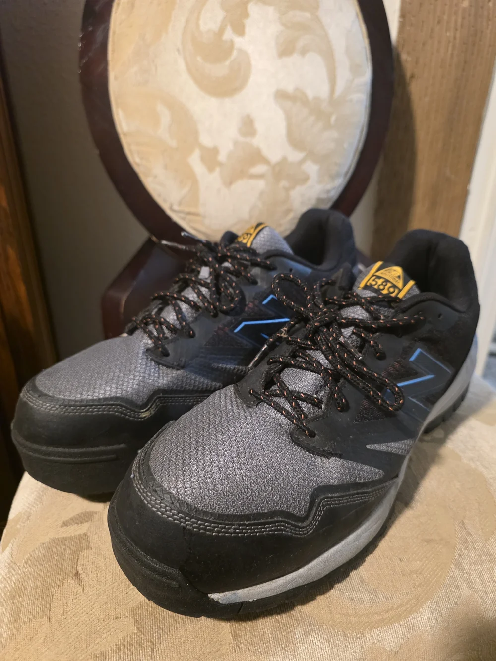 New Balance Gray and Black Men's Athletic Sneakers with Blue Accents