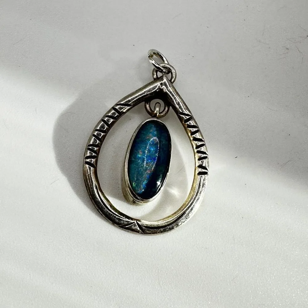 Marked Sterling‎ silver (HTS) and opal in resin pendant!
