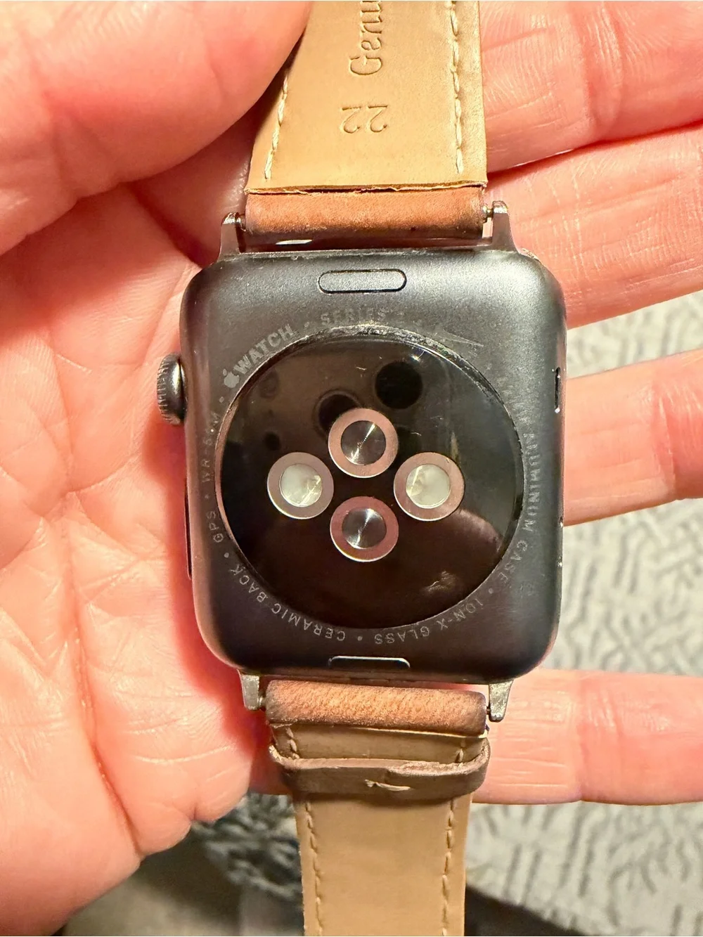 Apple Smartwatch with Brown Leather Strap and Black Screen