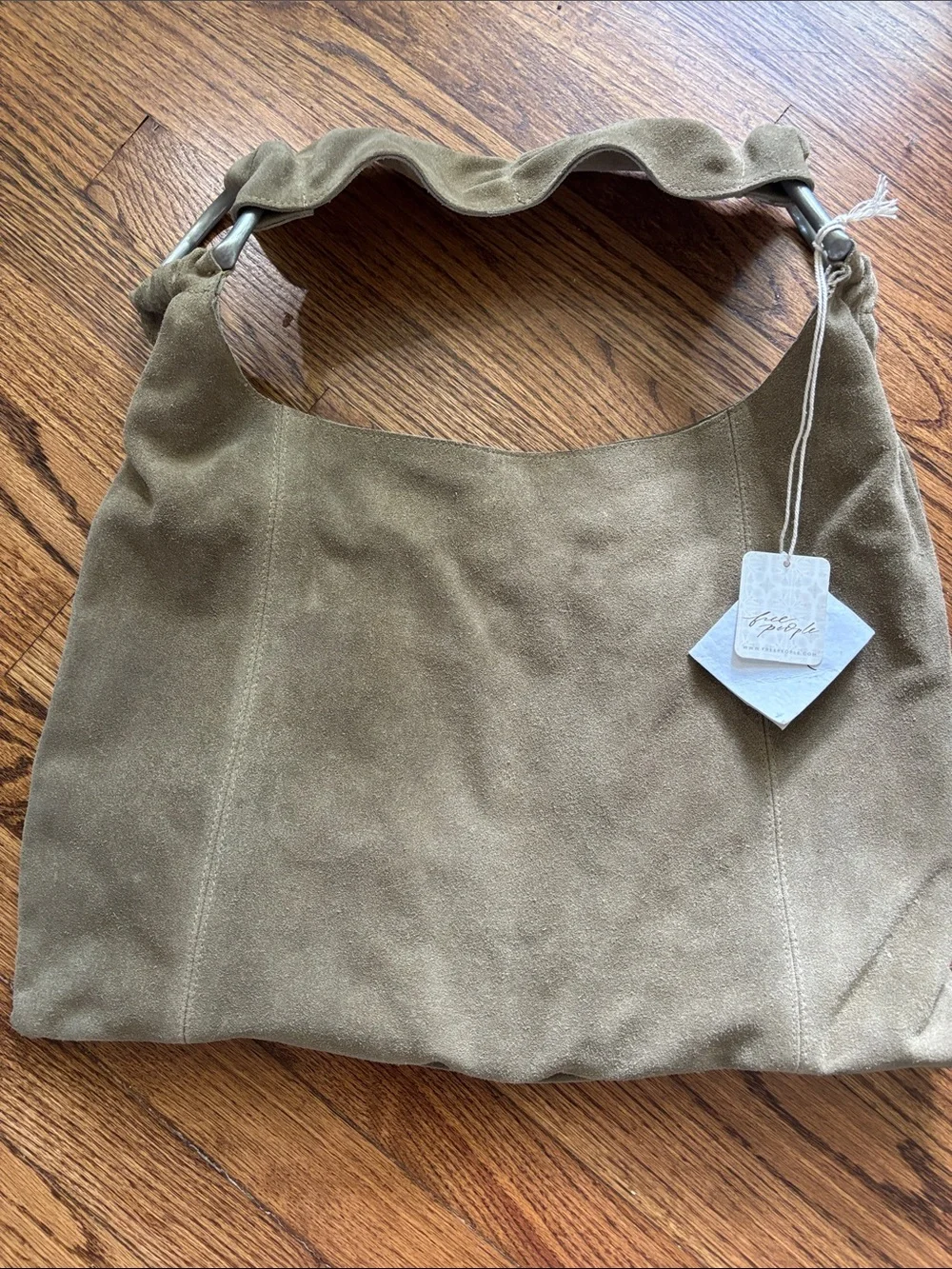 NWT Free People real suede leather bag with metal accents . Light sand color