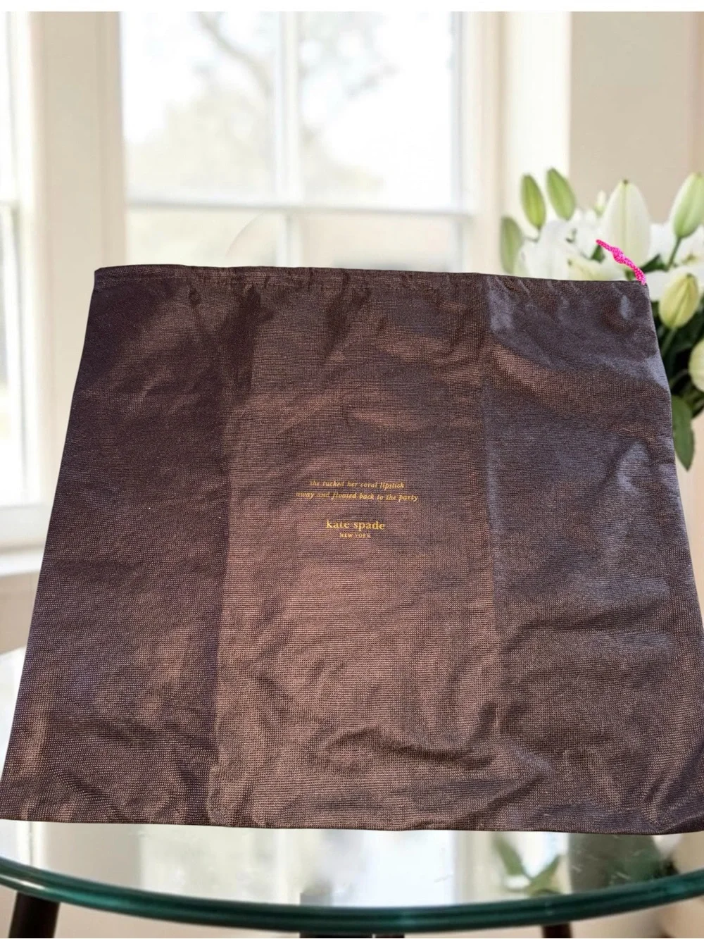 Kate Spade New York brown textured story book bust bag with gold writing 17x19