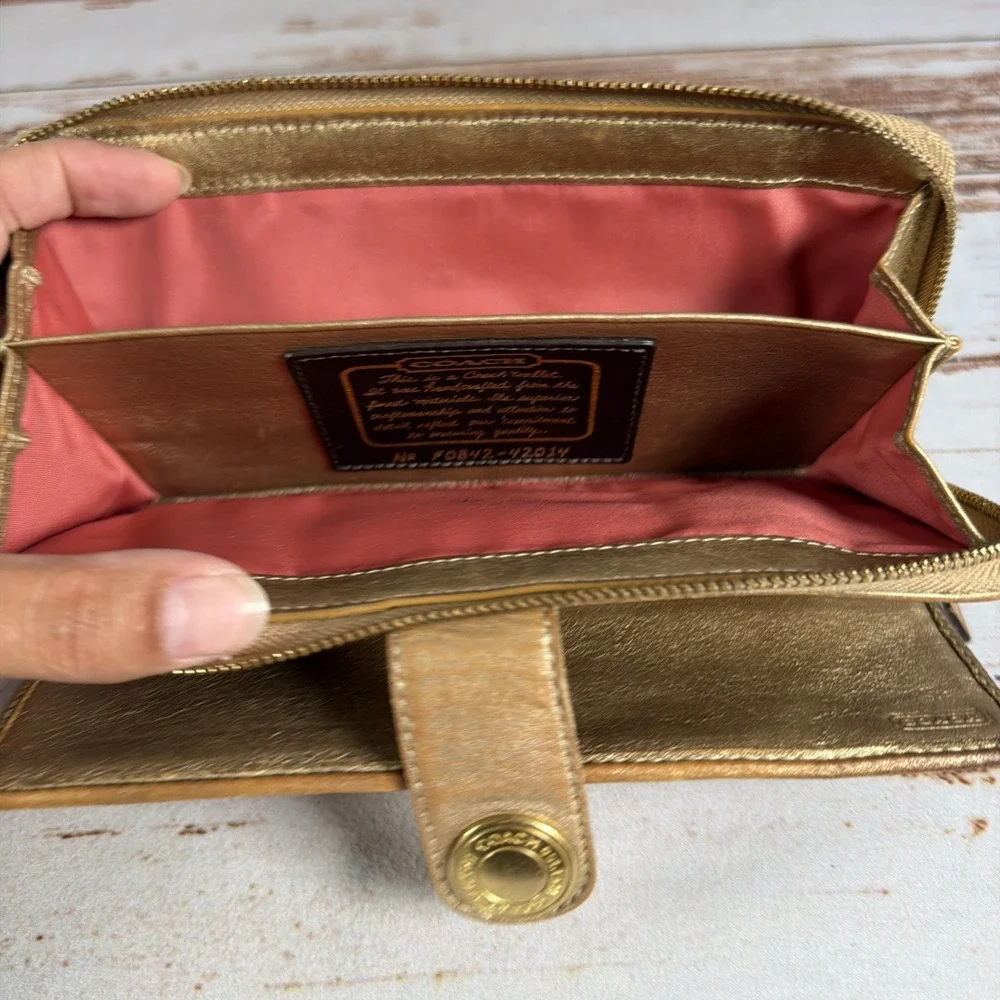 Coach gold signature