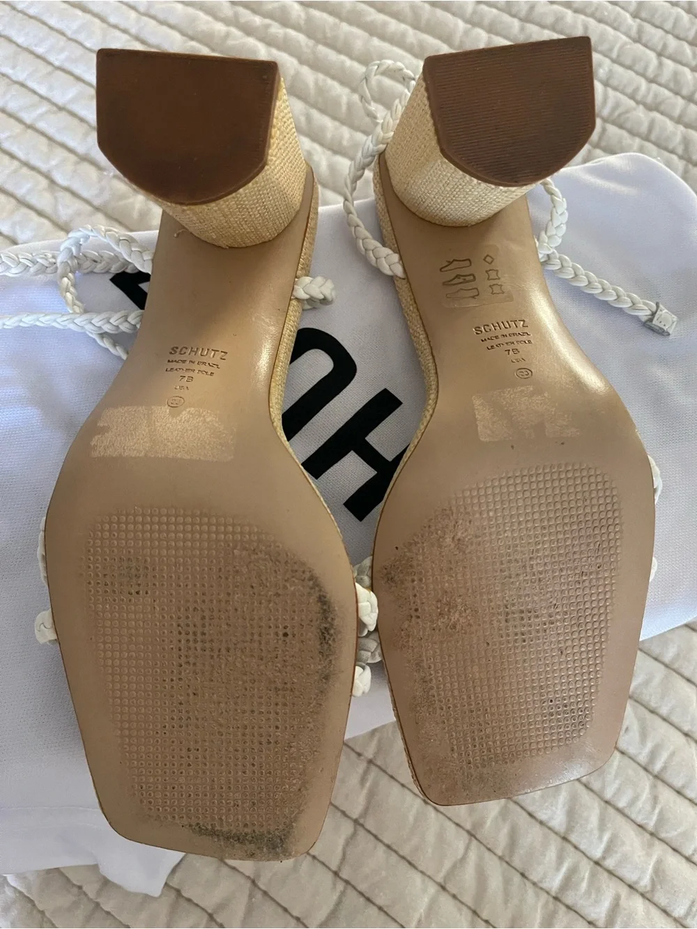SCHUTZ White Braided Strap Sandals with Daisy detail at toe.