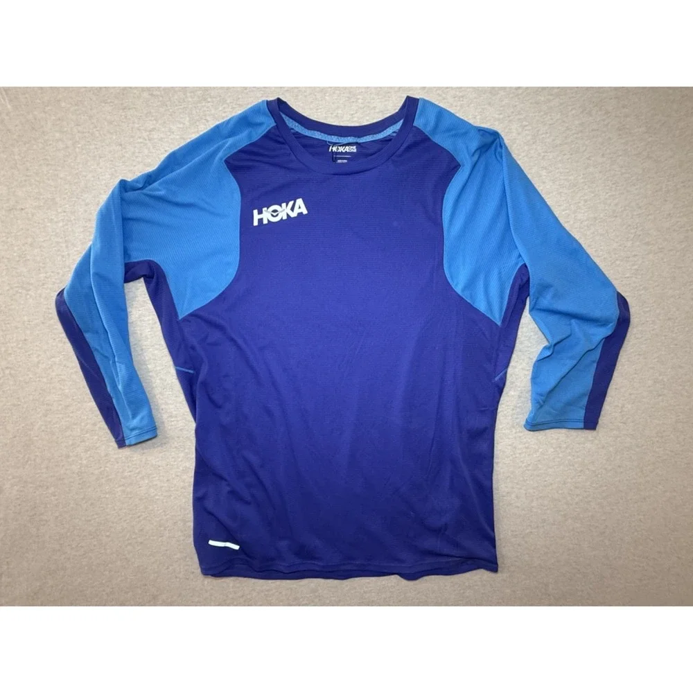 Hoka. Blue fitness shirt. size Medium. Blue 100% polyester 3/4 sleeve shirt