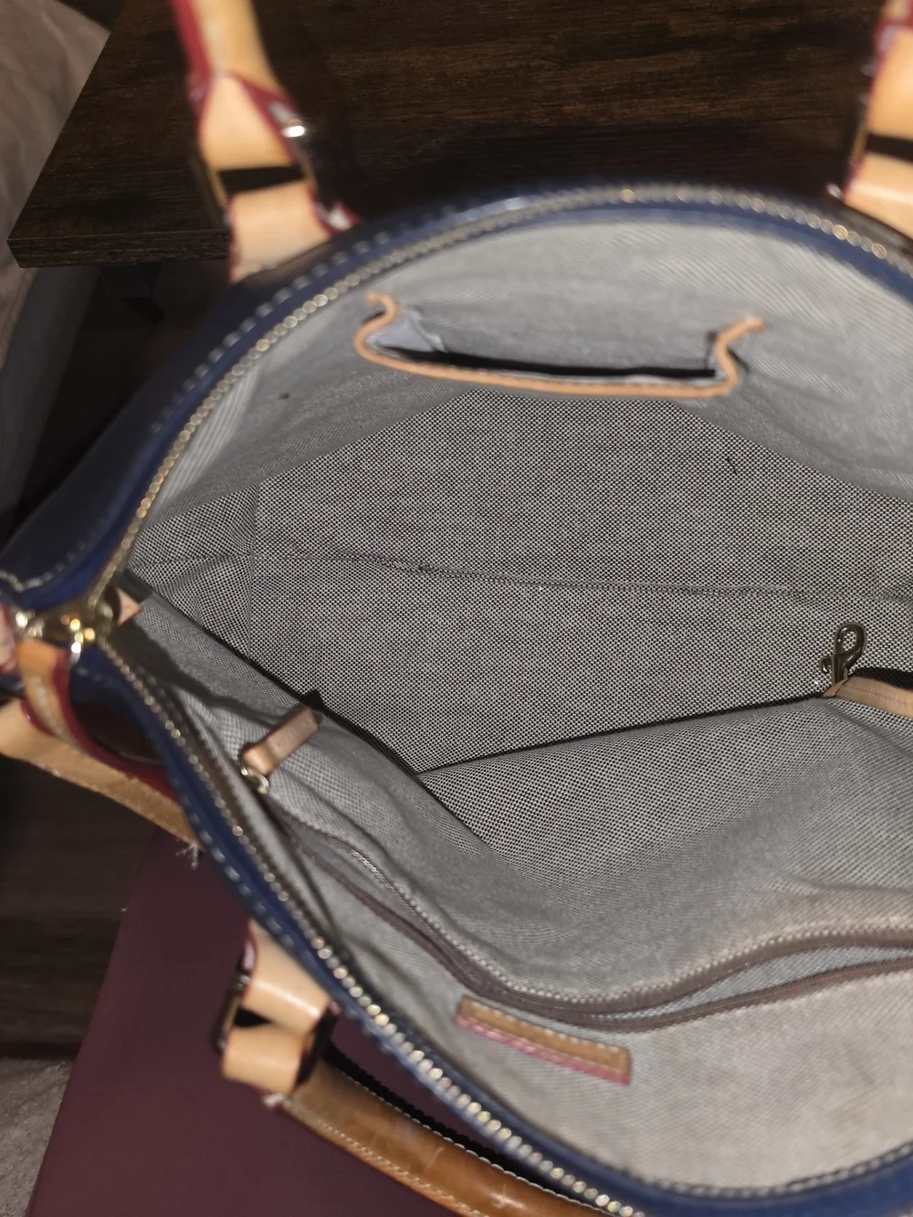 Dooney & Bourke signs gold