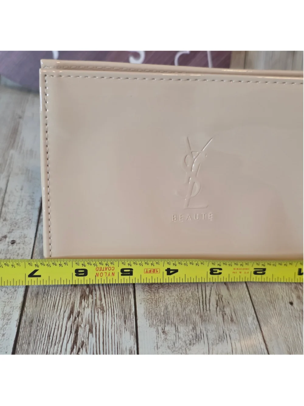 Yves Saint Laurent embossed minimalist measuring