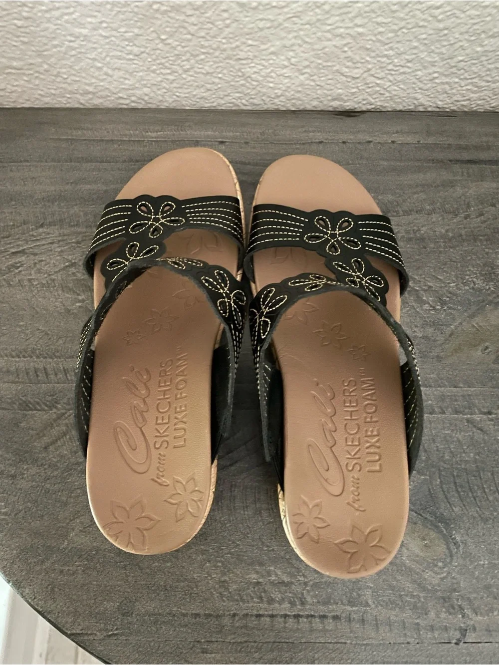 Cali from Skechers Luxe Foam Women's Black Floral Slide Sandals with Cork Wedge