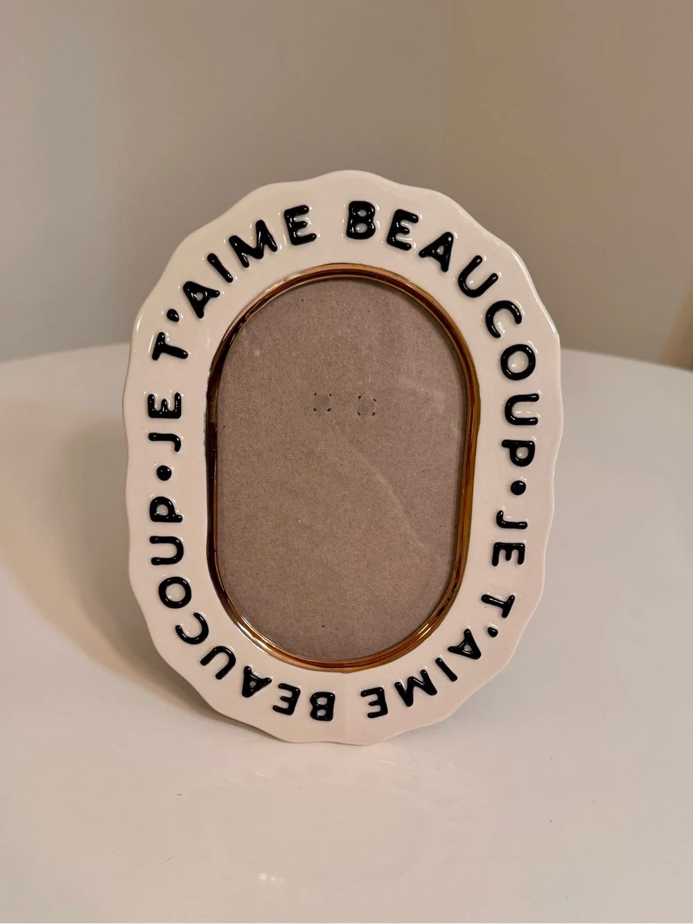Anthropologie White Ceramic Oval Frame with Black Script and Gold Trim