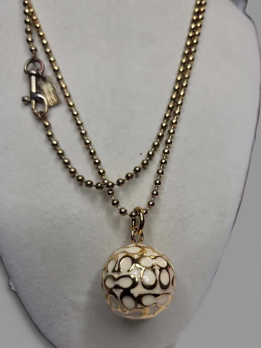Coach gold tone