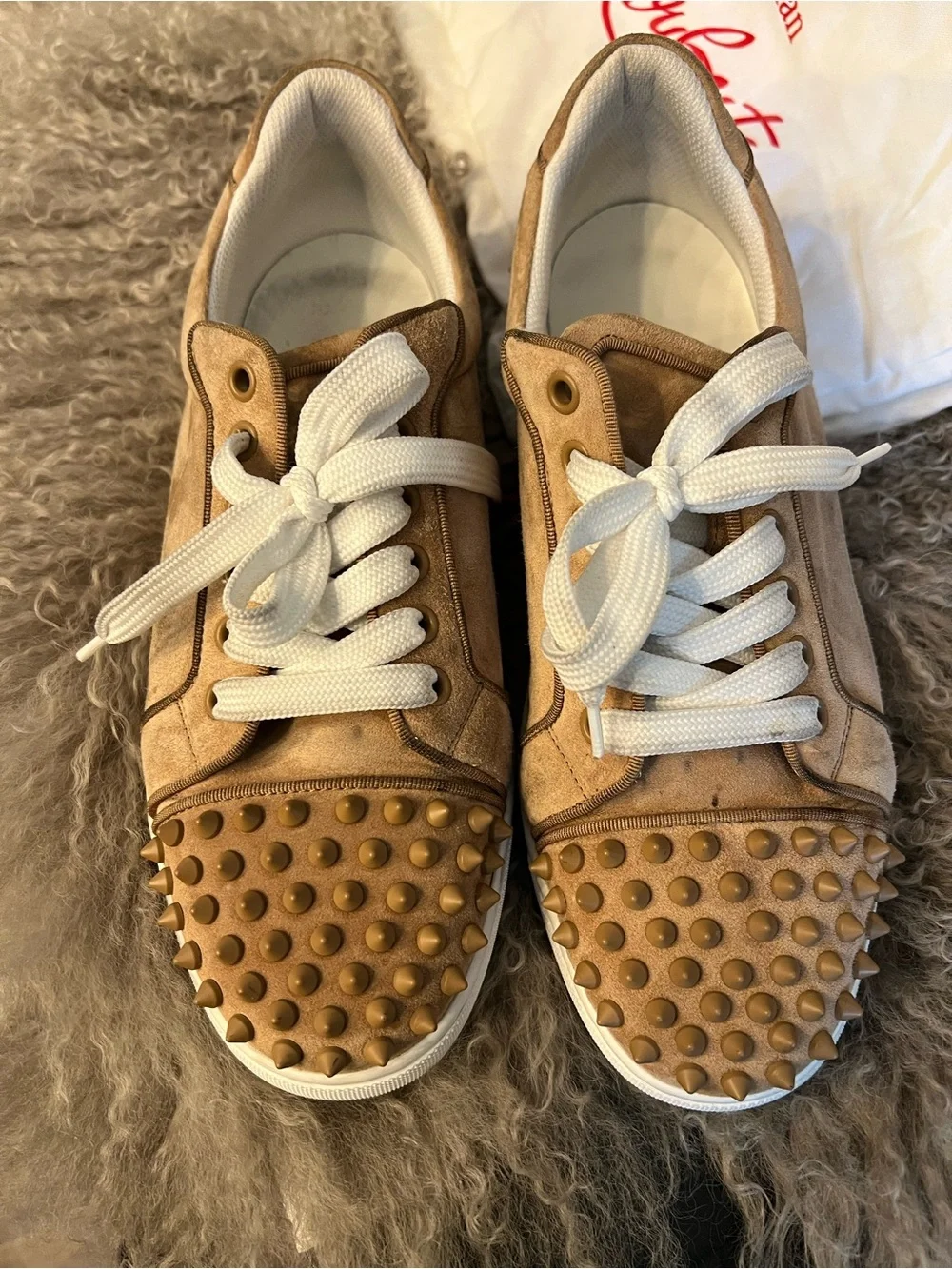 Christian Louboutin wearing small outfits