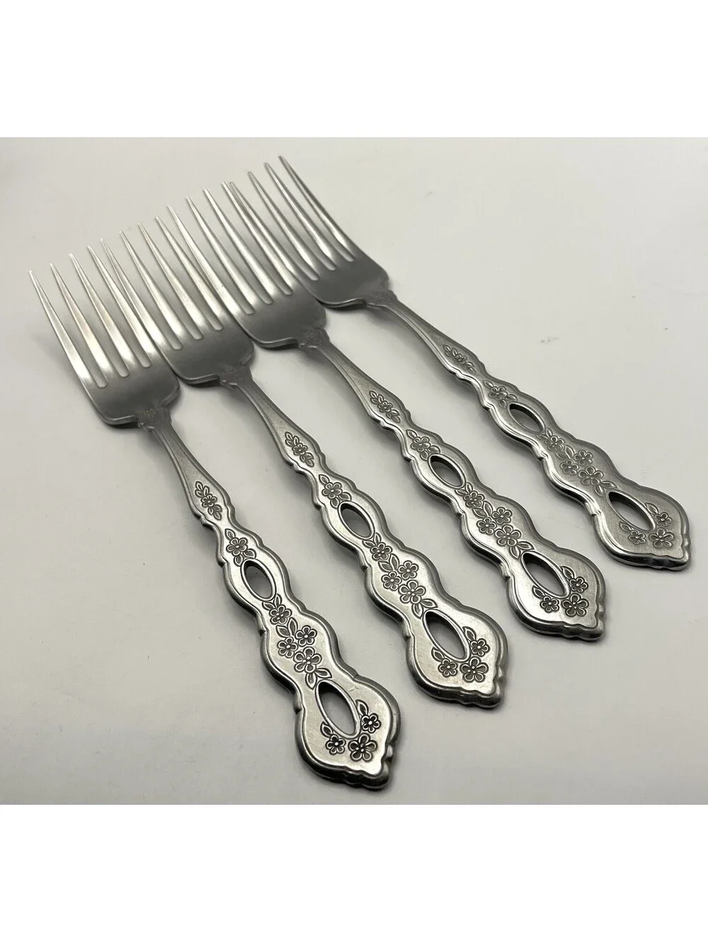 4- Oneida Community FANTASY Burnished Stainless Pierced Hndl Dinner Fork ~7.25”