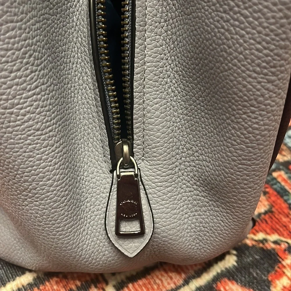 Coach polished pebble