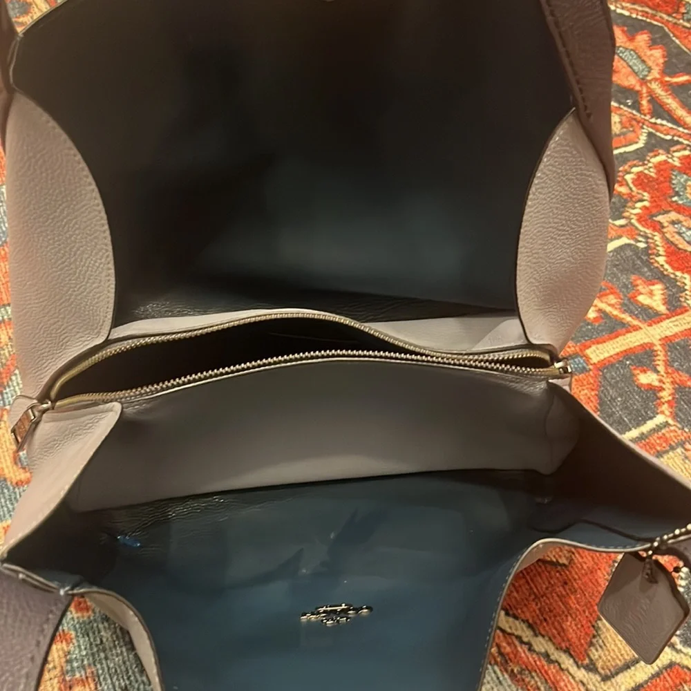 Coach polished pebble