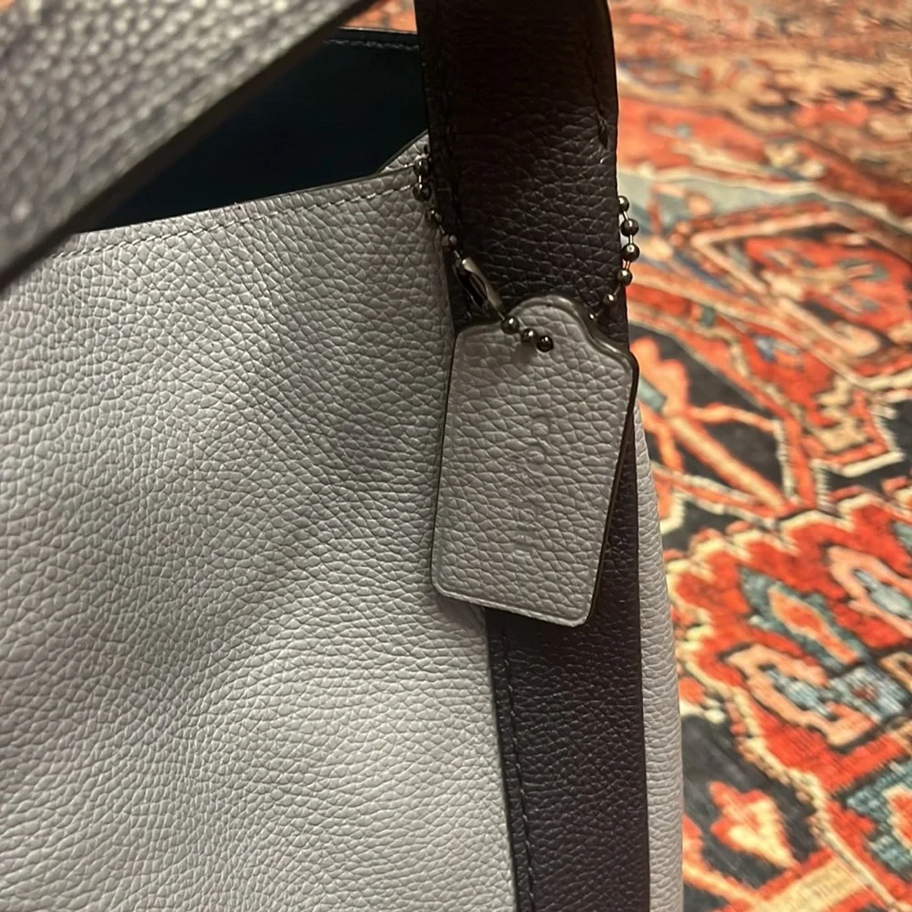 Coach polished pebble