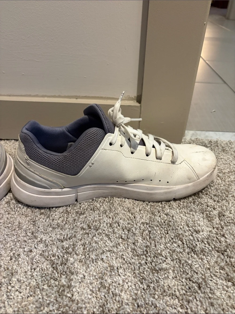 On Running “Roger” Sneaker. White and grey. Mens size 10.5. Used.
